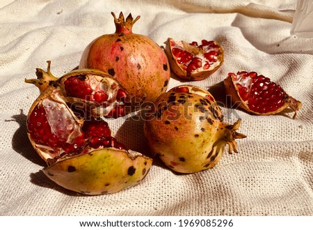 Beautiful Pomegranade Fruit In a Rustic Background