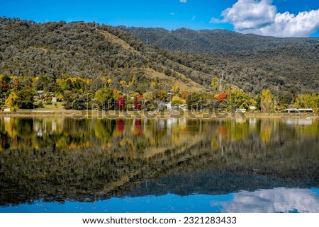 Beautiful pondage and reflections at Mount Beauty, Victoria, Australia. The Regulating Pondage is part of the Kiewa Hydroelectric Scheme. The town of Mount Beauty nestled at the foot of Mount Bogong