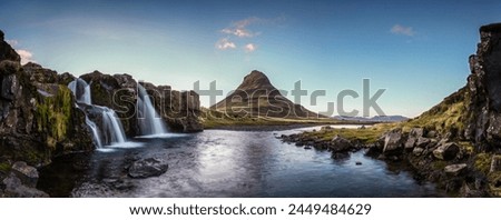 The beautiful and popular tourist place of great natural beauty at the waterfall Kirkjufellsfoss and the shapeliness mountain Kirkjufell on the north side of Snæfellsnes in the west of Iceland