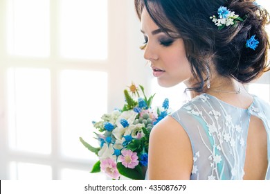 Beautiful portrait of bride in Wedding makeup and hair, jewelry, and bride model beauty girl face, beauty, bride, gorgeous, isolated rooms, Studio, series. Fashionable color of serenity.