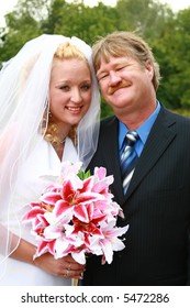 Beautiful Portrait Of Father Beside His Daughter On Her Wedding Day.