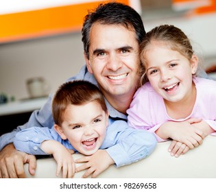 Beautiful Portrait Of A Father With His To Kids At Home