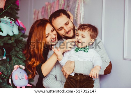 beautiful portrait of happy parents and their cute little son