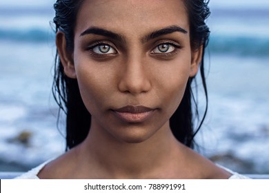 Beautiful portrait of indian woman with blue eyes