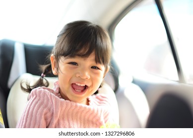 Beautiful Portrait Of Little Asian Child Girl Mixed Race Thai Russia Pakistan Smiling On The Car Seat Concept Safety Family Insurance Bangkok Thailand