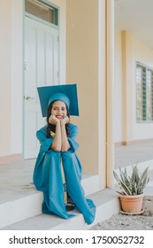 Beautiful Portrait Of A Pretty Asian Filipino Woman In Her Graduation Cap And Gown. Smiling And Cheerful As Graduating Senior Class On University Campus In The Philippines.