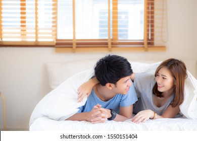 Beautiful Portrait Young Asian Couple Relax And Satisfied Together In Bedroom At Home, Family Lying On Bed Confident With Cheerful And Happy With Relationship, Man And Woman Dating.