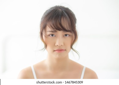 Beautiful portrait young asian woman having worry unhappy and upset about problem skin, beauty asia girl felling expression and emotion sad and bad, female having trouble and displeased.