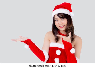 Beautiful portrait young asian woman Santa costume presenting empty plam with happy in holiday xmas, beauty model asia girl cheerful and surprise celebrating in Christmas isolated on white background. - Powered by Shutterstock