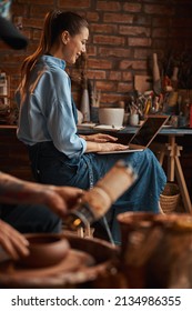 Beautiful Positive Craft Woman Wearing Apron Spending Time In Pottery Workshop