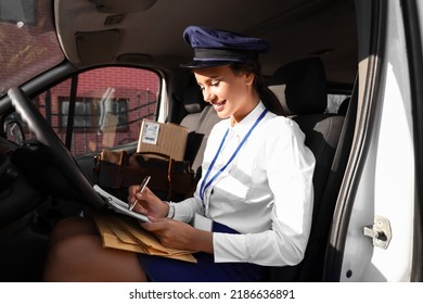 Beautiful Postwoman With Clipboard In Car