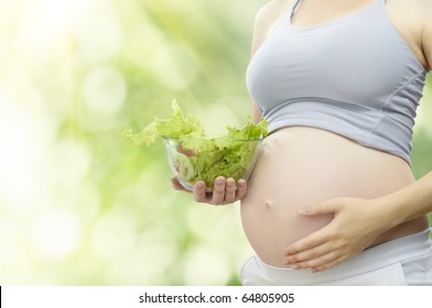 A Beautiful Pregnancy Woman Eating Healthy Food