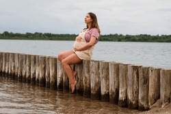Beautiful Pregnant Woman On A Beach