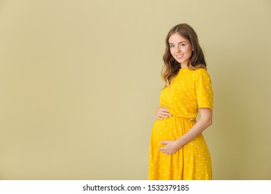 Beautiful Pregnant Woman On Color Background