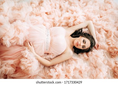 Beautiful Pregnant Woman At Pink Dress