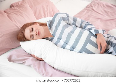 Beautiful Pregnant Woman Sleeping With Body Pillow