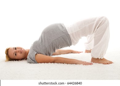 Beautiful pregnant woman smiling and doing exercises on the floor - isolated - Powered by Shutterstock