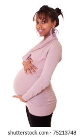Beautiful pregnant young black woman touching her belly