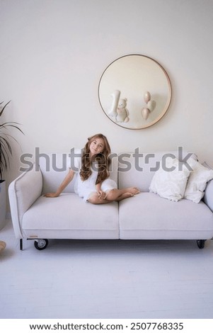 Similar – happy child girl playing at home in cozy weekend morning