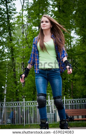 Beautiful pretty brunette girl on sport roller scates