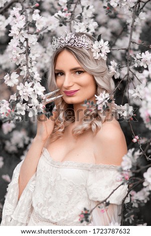 Beautiful princess with blooming tree