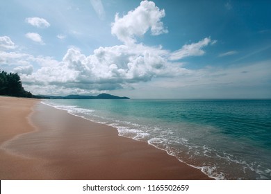 Beautiful pristine deserted beach Mai kao in Thailand on the island of Phuket