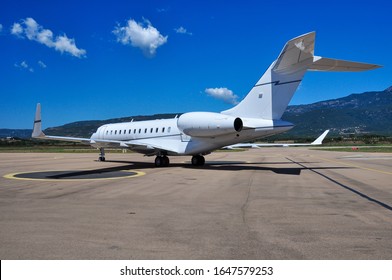 Beautiful Private Business Jet On The Tarmac Of Figari Airport. Super Rich Lifestyle During Summertime.