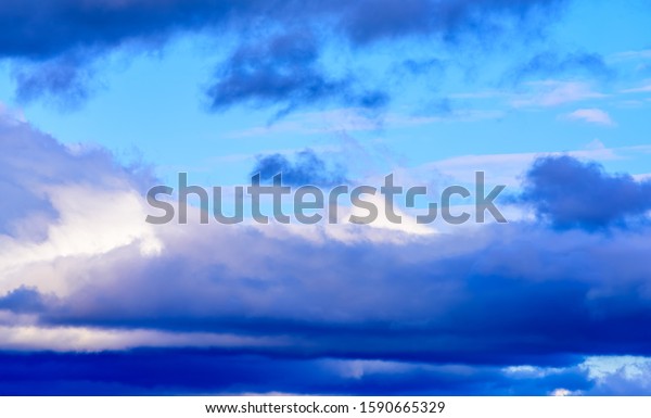Beautiful\
puffy clouds isolated against pastel blue\
skies