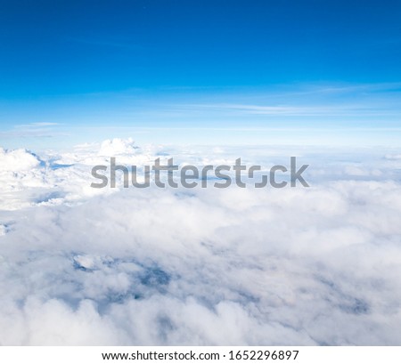 Beautiful puffy high altitude clouds against blue skies.