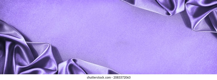 Beautiful purple pink silk satin background. Soft folds. Shiny fabric. Luxury lilac background with copy space for design. Wide banner. Flat lay, top view. Birthday, wedding, Christmas, Valentine. - Shutterstock ID 2083372063