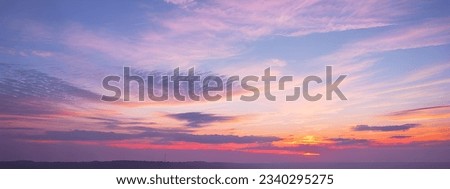 Beautiful purple tinted sunset sky and clouds, dramatic sunset