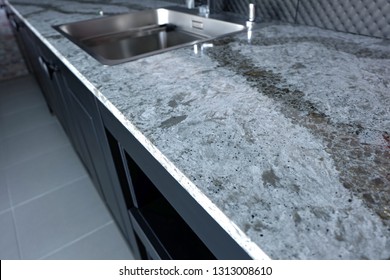 Beautiful Quartz Stone Worktop On Wooden Kitchen Cabinet With  Appliances And Sanitary.