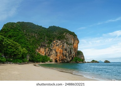 The beautiful Railay Beach and Krabi, Thailand. Railay Beach Krabi Thailand, the tropical beach of Railay Krabi, Panoramic view of idyllic Railay Beach with a traditional long boat and a cloudy sky - Powered by Shutterstock