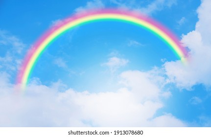 Beautiful Rainbow And Blue Sky With Cloud In Summer Day.