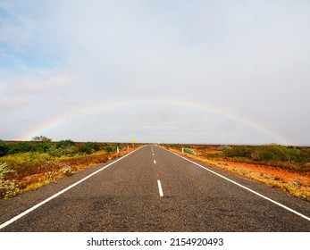 Beautiful Rainbow On Empty Street In Western Australia