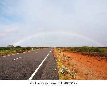 Beautiful Rainbow On Empty Street In Western Australia