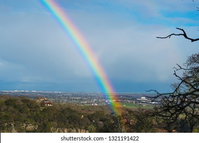 Beautiful Rainbow Over Houses And Rural Landscape, Showing End Of Rainbow And Sunlit Valley In Northern California Upscale Wine Country Neighborhood