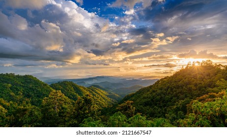 beautiful rainforest mountains landscape in cloudy day at sunset