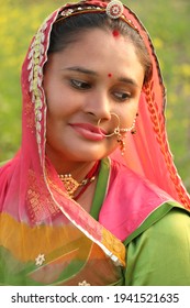 beautiful Rajasthani (Rajput) woman smiled with lowered eye. beautiful Indian ( Rajasthani) woman. close-up.