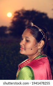 beautiful Rajasthani woman wearing her culture dress and gold jewelry in the evening. beautiful Rajasthani woman. close-up. 