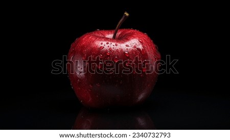 Beautiful red apple on a black background.