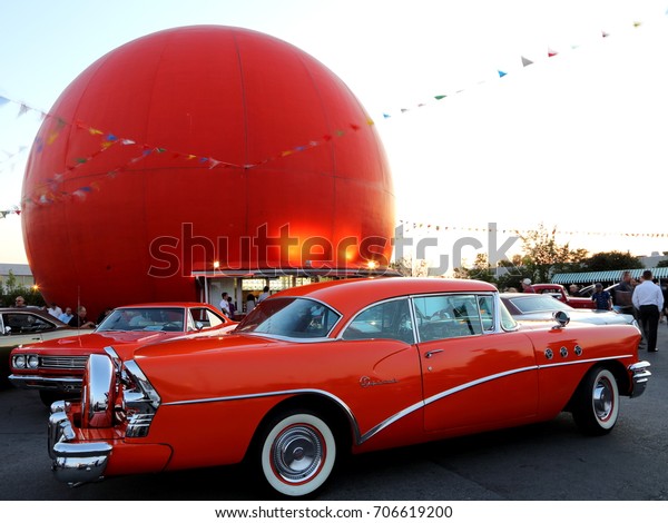 Beautiful red classic car at summer car show in\
Gibeau Orange Julep restaurant parking, Montreal, Quebec, Canada,\
July 15, 2015