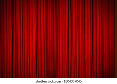 Beautiful red curtains of the stage lit with stage lights, moments before the curtains went up to reveal the stage - Shutterstock ID 1804357045