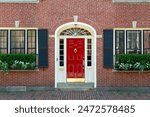 Beautiful red door on charming brick house, Boston, Massachusetts, USA