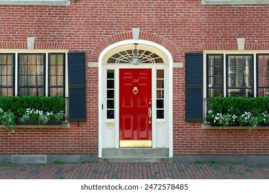 Beautiful red door on charming brick house, Boston, Massachusetts, USA - Powered by Shutterstock