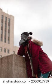 Beautiful Red Female Plague Doctor Dancing And Posing.