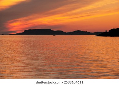 Beautiful red and gold sunset landscapes over the lake. Twilight, reflection, clouds. Peace, tranquility, eternity, relaxation, meditation. Beautiful landscape, background, design - Powered by Shutterstock