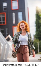 Beautiful Red Hair Student Girl Walking Through University Yard