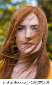 Beautiful red haired irish girl with blu eyes, red hair and lots of freckles