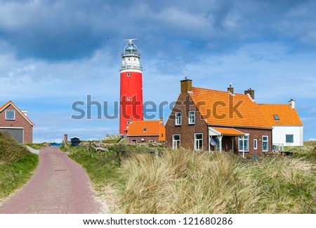 Beautiful red Lighthouse with road, island Texsel, Netherlands. Panorama